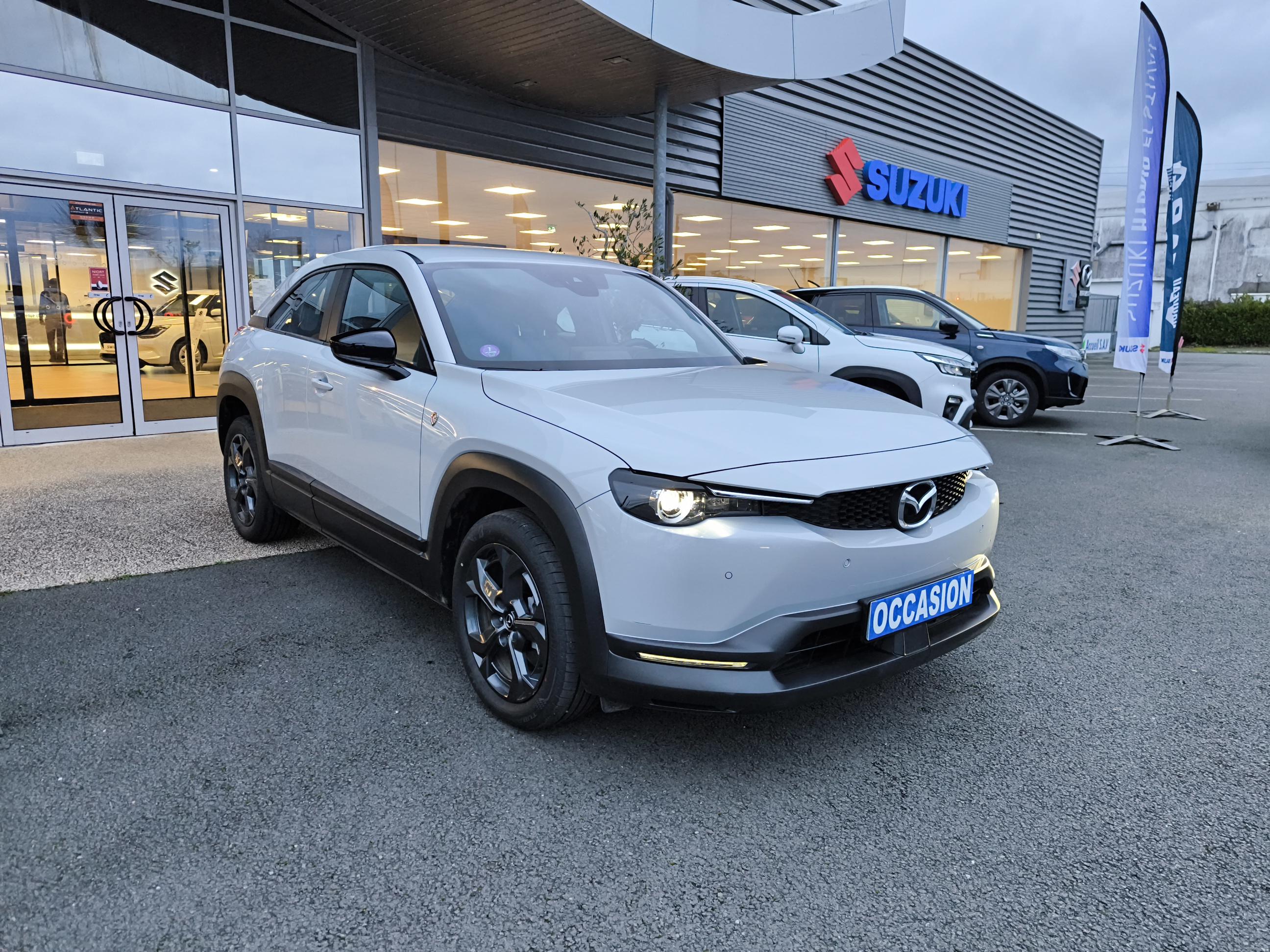 MAZDA MX-30 R-EV e-Skyactiv 170 ch BVA Prime-Line - Véhicule Occasion - Océane Auto MAZDA MX-30 R-EV e-Skyactiv 170 ch BVA Prime-Line - Véhicule Occasion Océane Auto