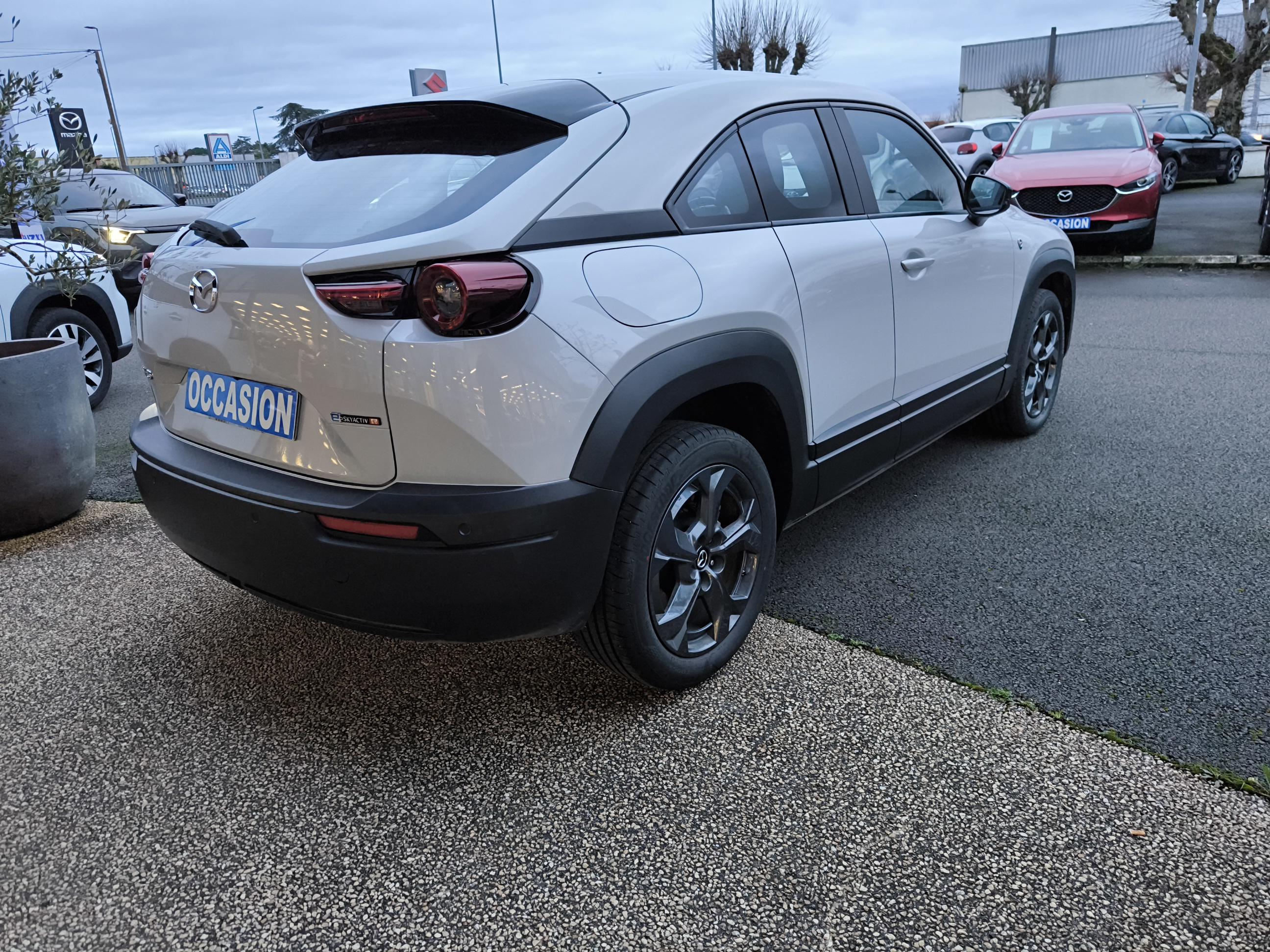 MAZDA MX-30 R-EV e-Skyactiv 170 ch BVA Prime-Line - Véhicule Occasion - Océane Auto MAZDA MX-30 R-EV e-Skyactiv 170 ch BVA Prime-Line - Véhicule Occasion Océane Auto