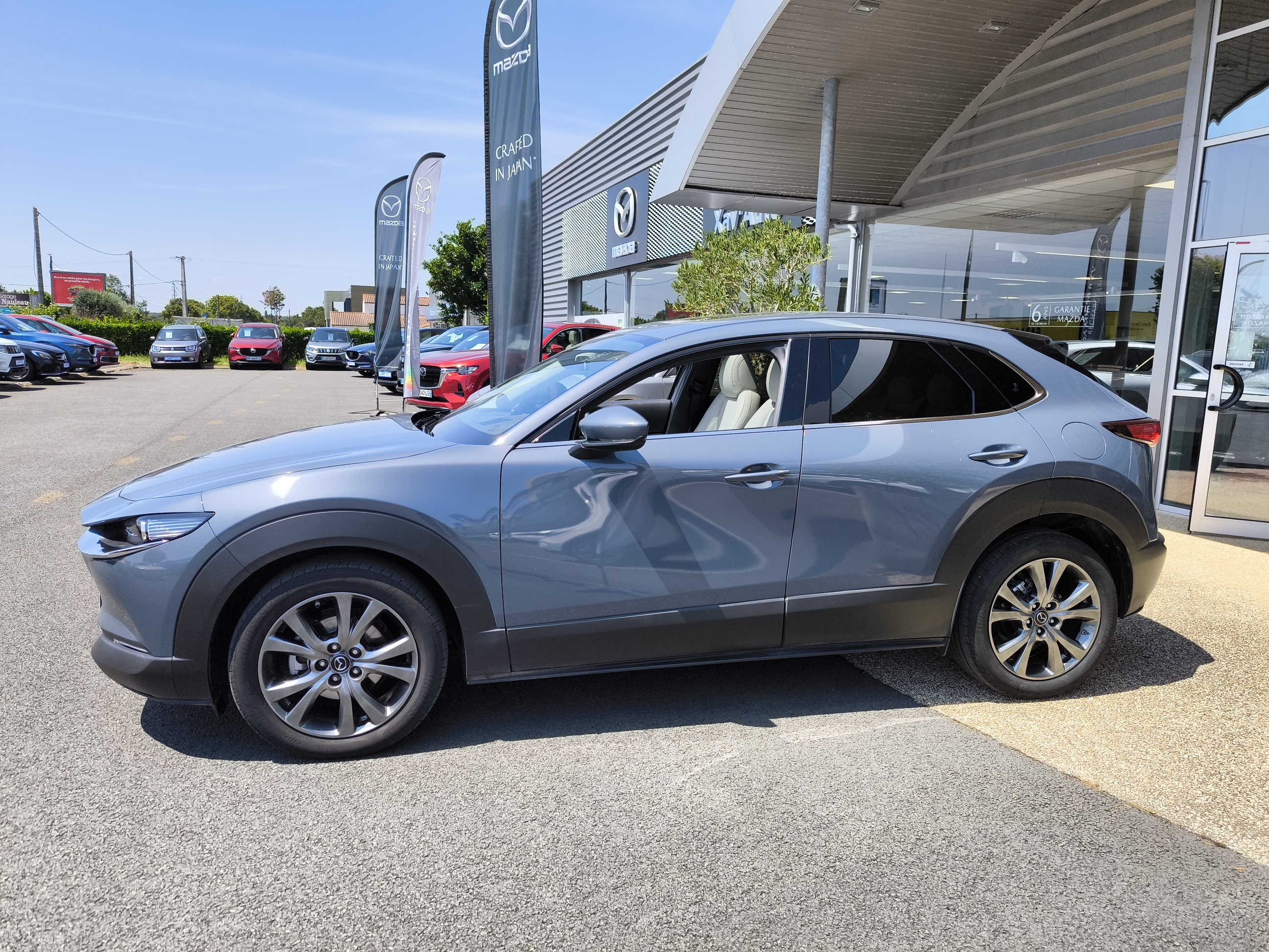 MAZDA CX-30 2.0L e-SKYACTIV X M Hybrid 186 ch 4x2 BVA6 Exclusive Cuir Pure-White - Véhicule Occasion - Océane Auto MAZDA CX-30 2.0L e-SKYACTIV X M Hybrid 186 ch 4x2 BVA6 Exclusive Cuir Pure-White - Véhicule Occasion Océane Auto