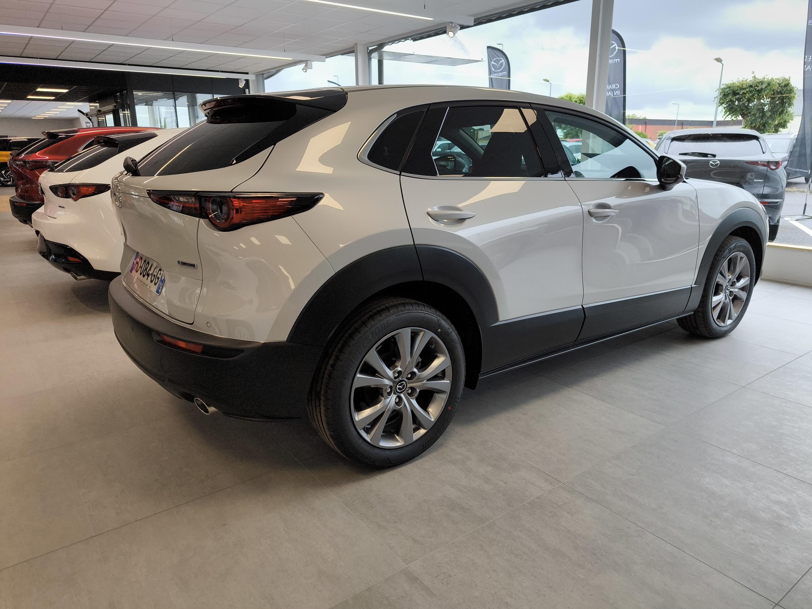MAZDA CX-30 2.5L e-SKYACTIV G M Hybrid 140 ch 4x2 BVA6 Exclusive-Line - Véhicule Occasion - Océane Auto MAZDA CX-30 2.5L e-SKYACTIV G M Hybrid 140 ch 4x2 BVA6 Exclusive-Line - Véhicule Occasion Océane Auto