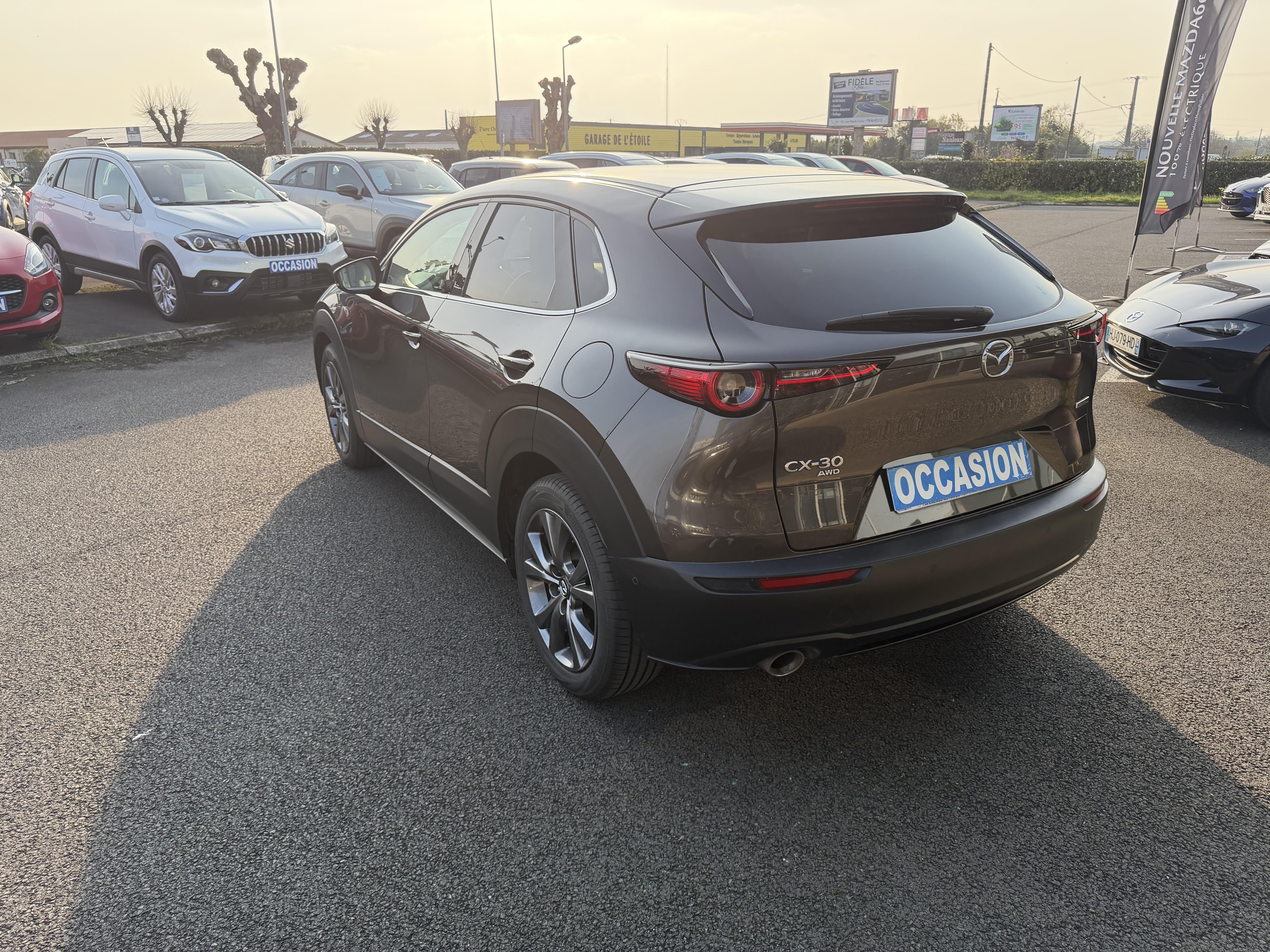 MAZDA CX-30 2.0L SKYACTIV-X M Hybrid 180 ch 4x4 BVA6 Exclusive - Véhicule Occasion - Océane Auto MAZDA CX-30 2.0L SKYACTIV-X M Hybrid 180 ch 4x4 BVA6 Exclusive - Véhicule Occasion Océane Auto