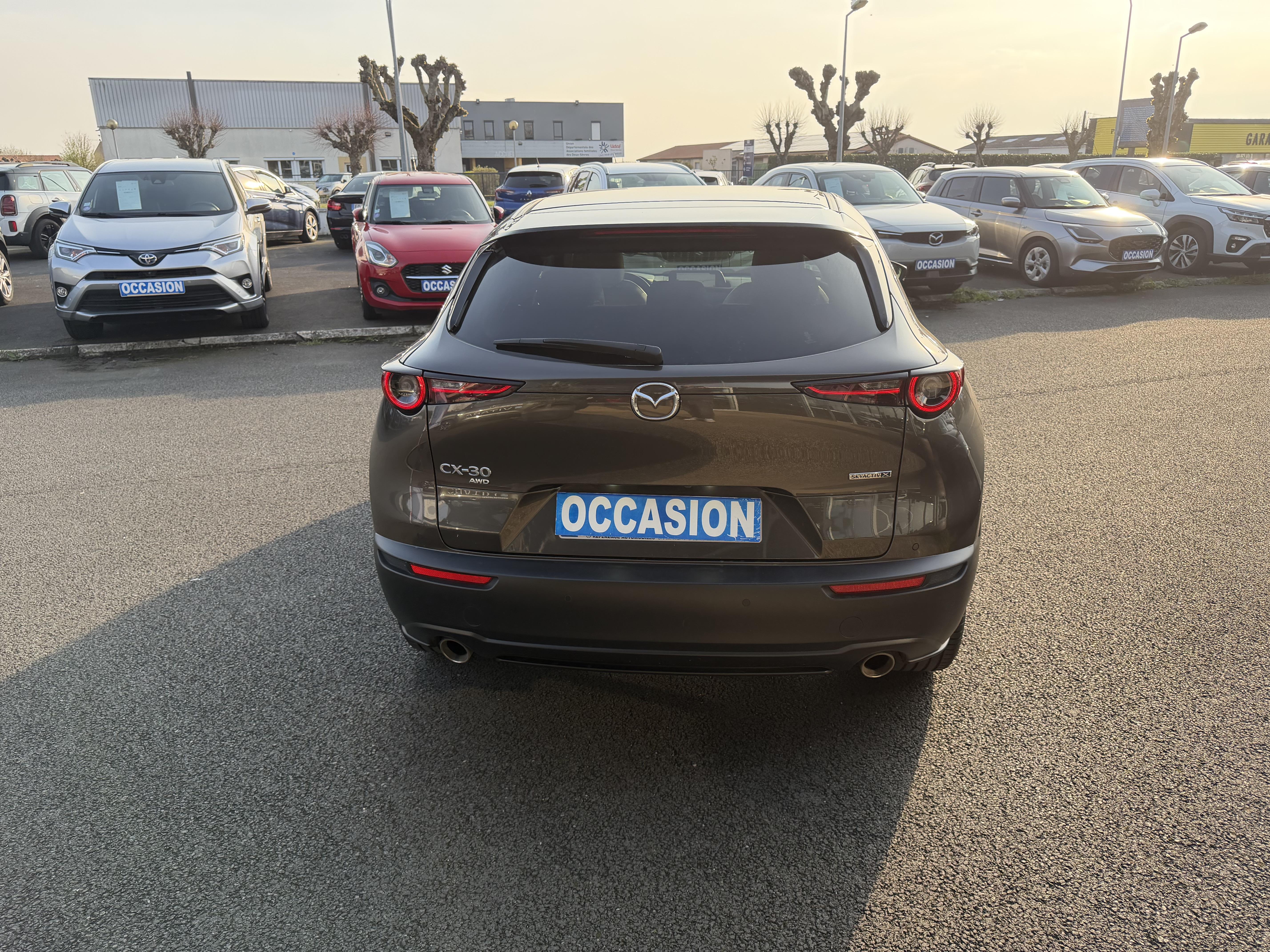 MAZDA CX-30 2.0L SKYACTIV-X M Hybrid 180 ch 4x4 BVA6 Exclusive - Véhicule Occasion - Océane Auto MAZDA CX-30 2.0L SKYACTIV-X M Hybrid 180 ch 4x4 BVA6 Exclusive - Véhicule Occasion Océane Auto